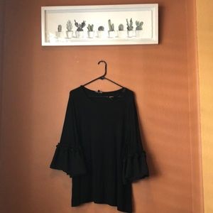 Black top with chiffon ruffle detail on sleeve